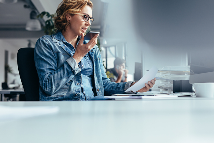 A woman using voice assist. 