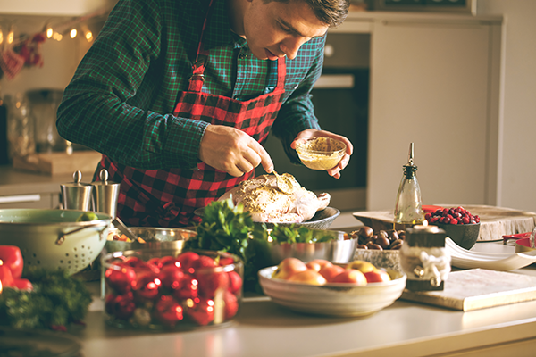 A man preparing a holiday dinner